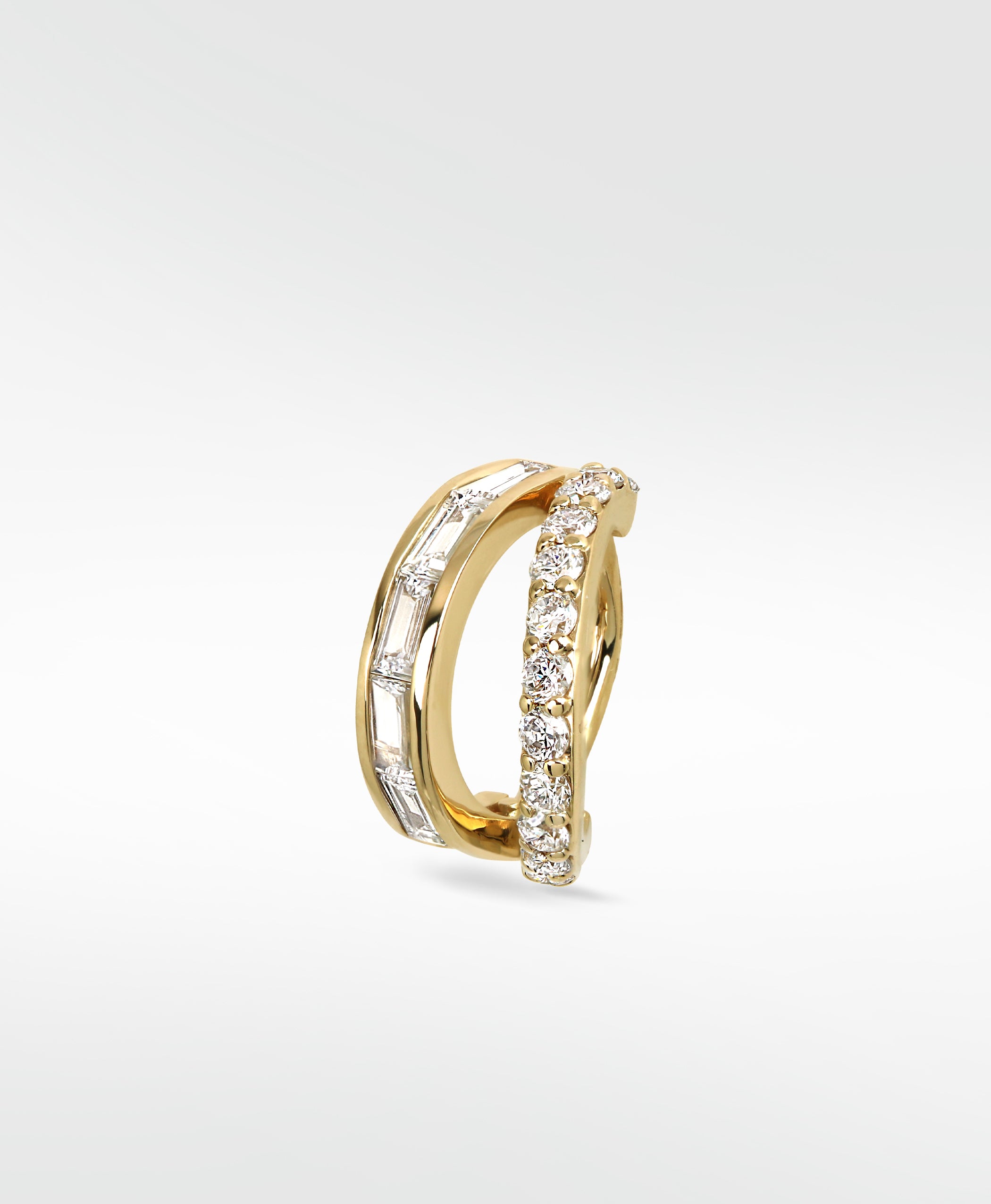 Close-up of the Modernist Double Diamond Hoop with parallel bands of baguette and round diamonds set in polished yellow gold.