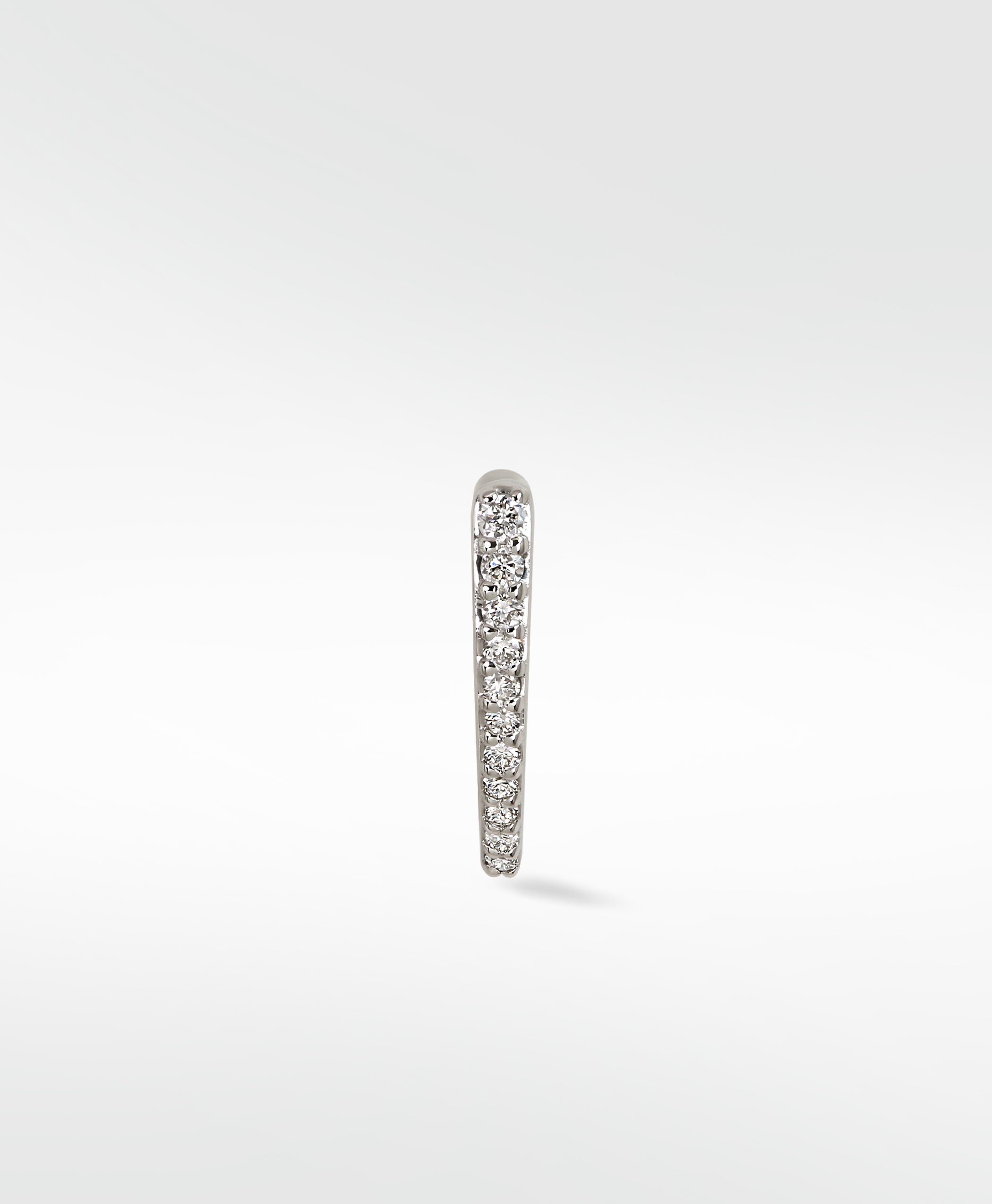 Side view of the Lark & Berry Modernist Pave Hoop in 14k gold, showing a brilliant row of graduating diamonds.