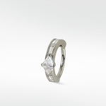 Modernist hoop earring in white gold with a triangle diamond and channel-set baguette diamonds.