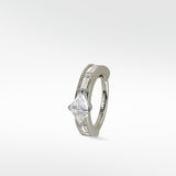 Modernist hoop earring in white gold with a triangle diamond and channel-set baguette diamonds.