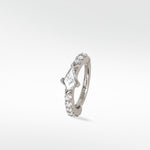 Modernist Kite Diamond Hoop earring in 14k white gold with a central kite-cut diamond and brilliant cut pavé diamonds.