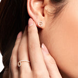 Model wearing Lark & Berry's Modernist Sun Shimmer Stud Earrings with 14K yellow gold and lab-created diamonds.